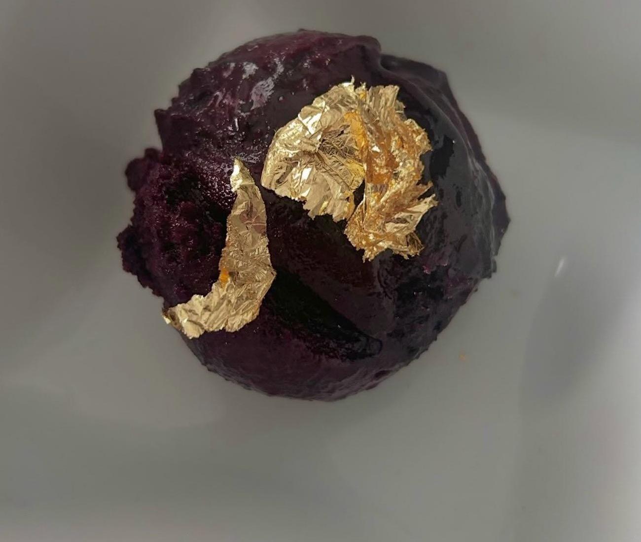 House-made Blueberry Basil Gelato finished with gold leaf